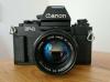 Canon NEW F-1 mit 50 mm 11.4 FD Objektiv,  AE Motor Drive und Blitzgerät 155A