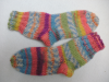 Socken,  Schals und Mützen aufwendig von Hand gestrickte Unikate zu verkaufen