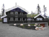 Ein norwegisches,  handgemachtes Naturstammhaus